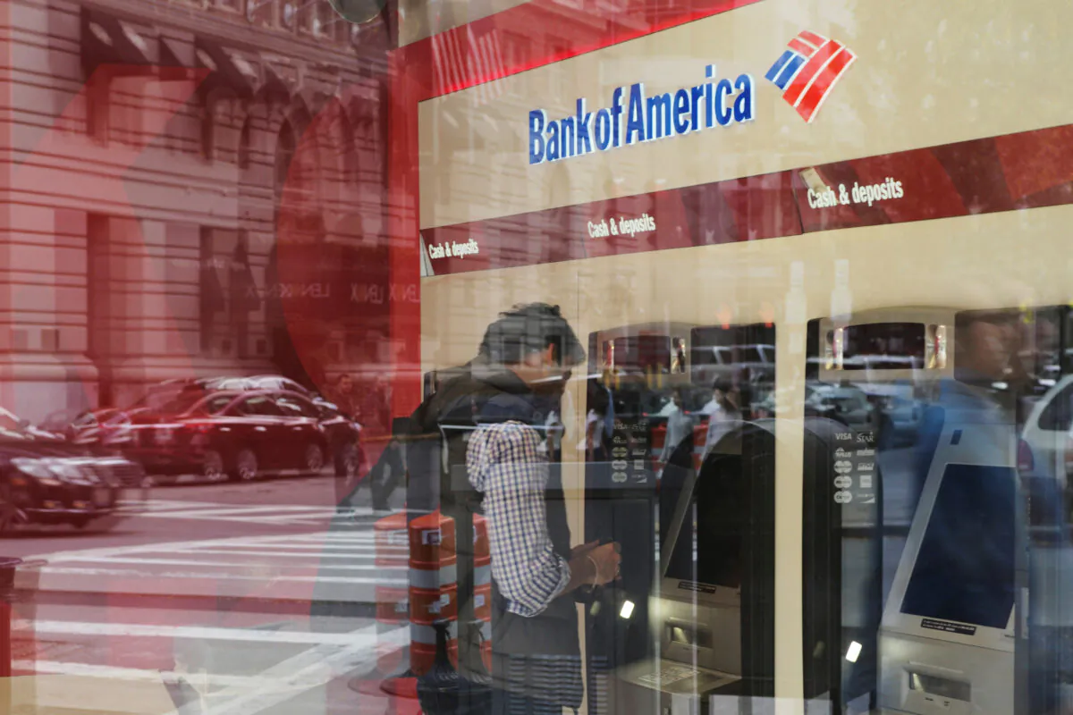 A customer uses a Bank of America ATM in Boston, Mass., on Oct. 11, 2017. (Brian Snyder/Reuters)