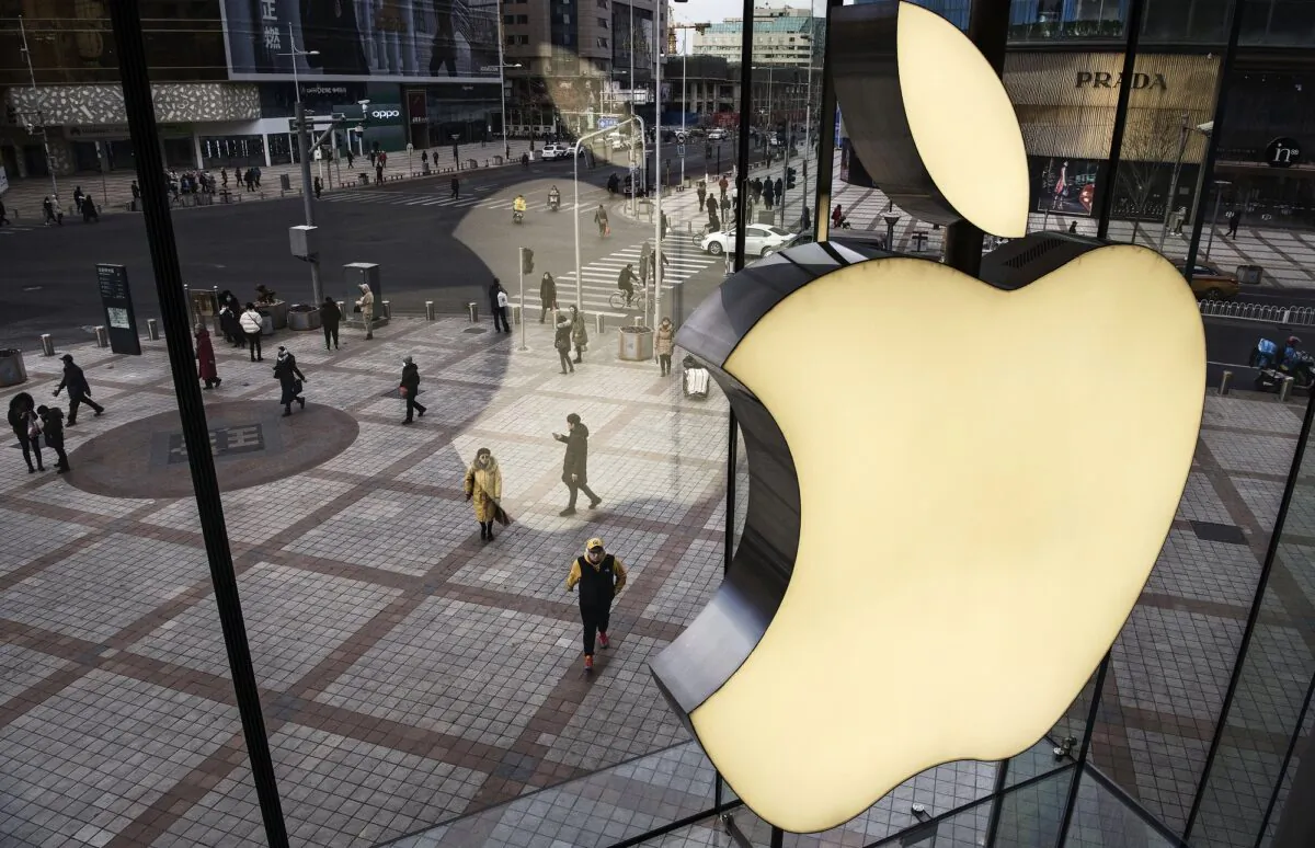 The Apple logo on the window at an Apple Store in Beijing on Jan. 7, 2019. (Kevin Frayer/Getty Images)
