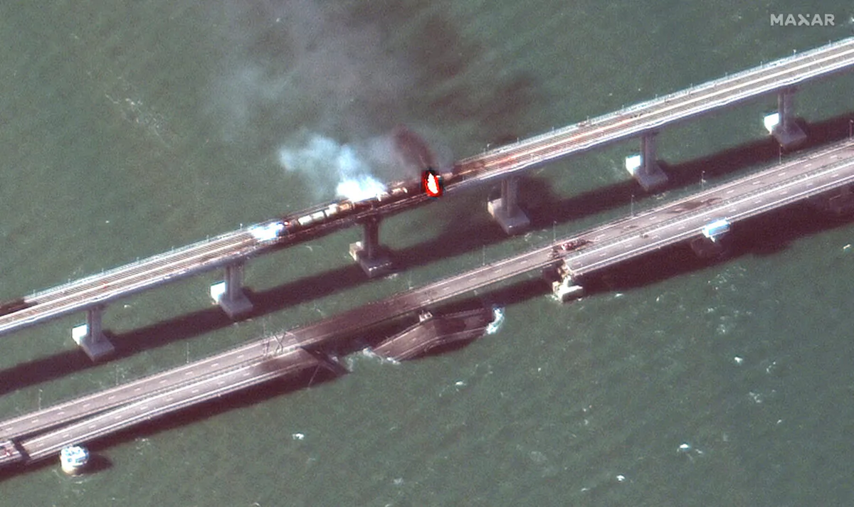 Smoke rises from a fire on the Kerch bridge in the Kerch Strait, Crimea, on Oct. 8, 2022, in a satellite image. (Maxar Technologies/Handout via Reuters)