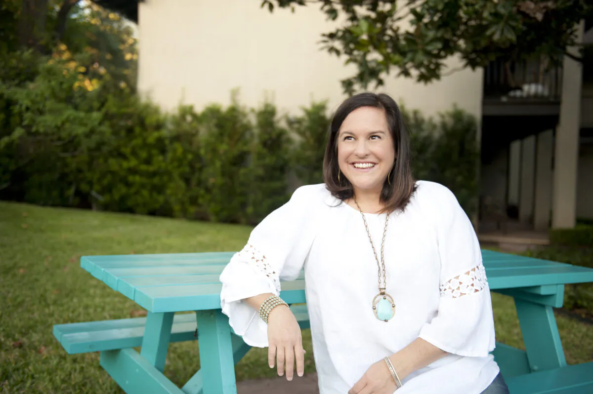 Kristin Schell, author and founder of "The Turquoise Table" and "Front Yard People" movement, sits at her own turquoise table. (Courtesy of Kristin Schell)