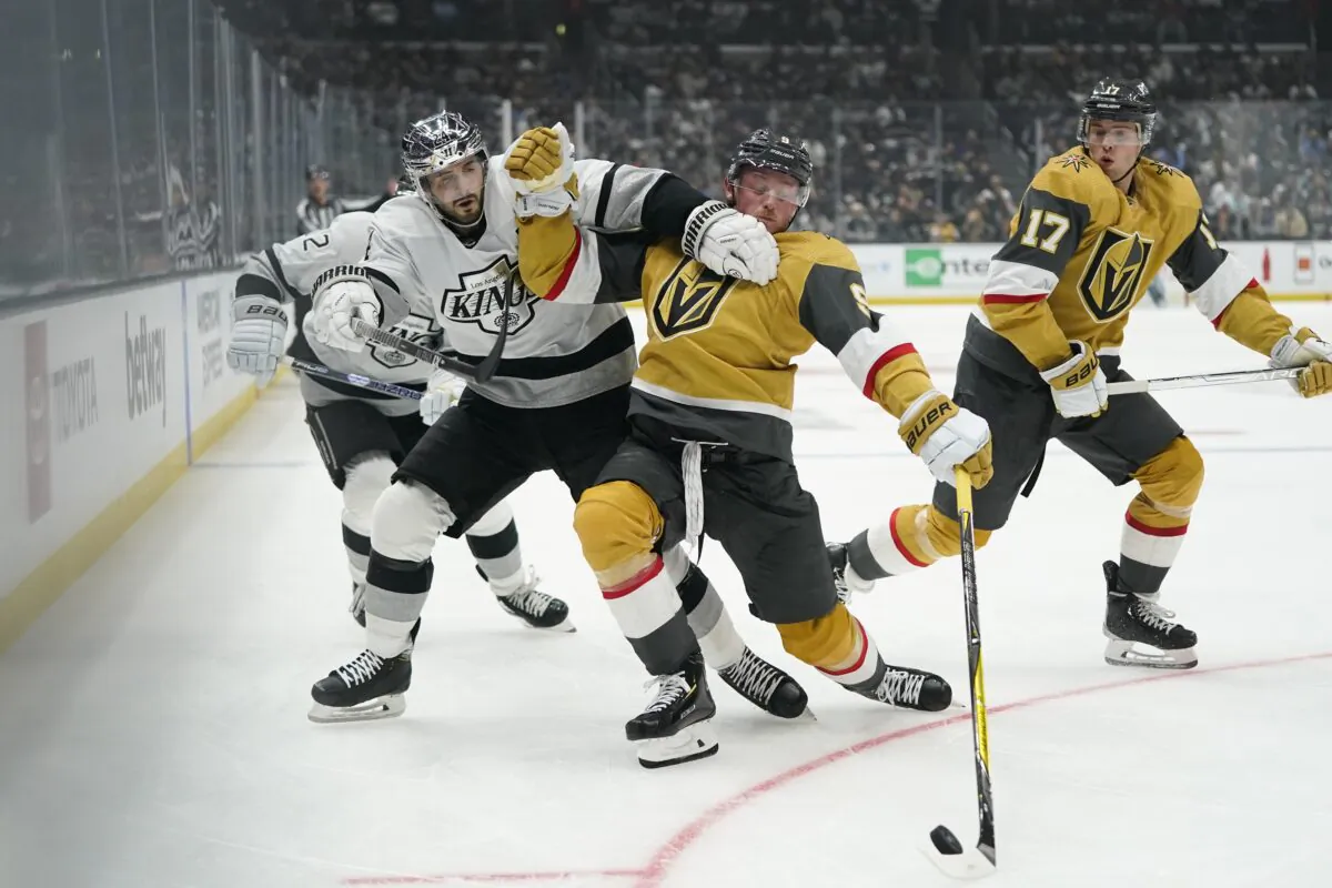 Las Vegas Golden Knights' Jack Eichel, (3rd L) loses balance while being pressured by Los Angeles Kings' Phillip Danault during the second period of an NHL hockey game in Los Angeles on Oct. 11, 2022. (Jae C. Hong/AP Photo)