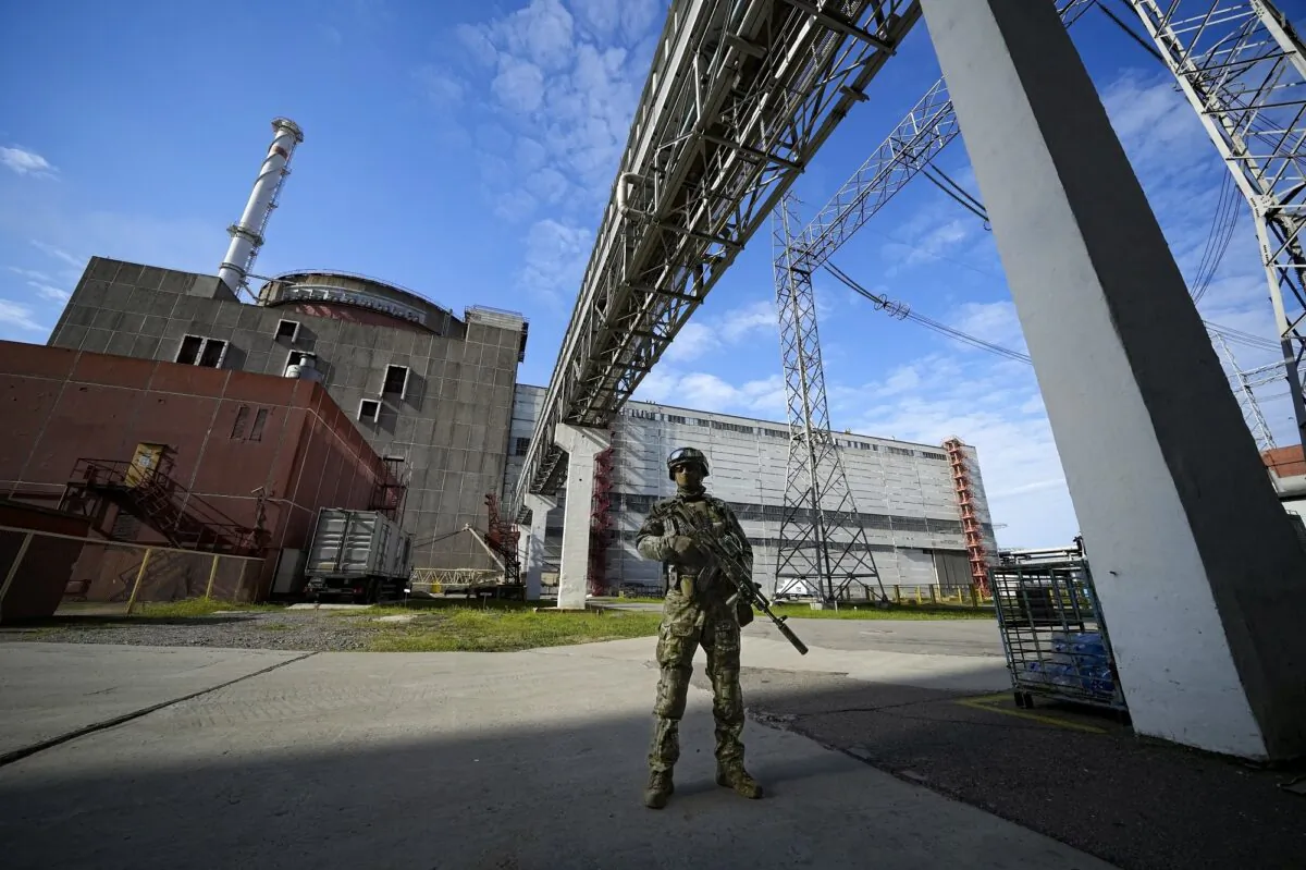 A Russian serviceman guards in an area of the Zaporizhzhia Nuclear Power Station in territory under Russian military control, southeastern Ukraine, on May 1, 2022. (AP Photo)