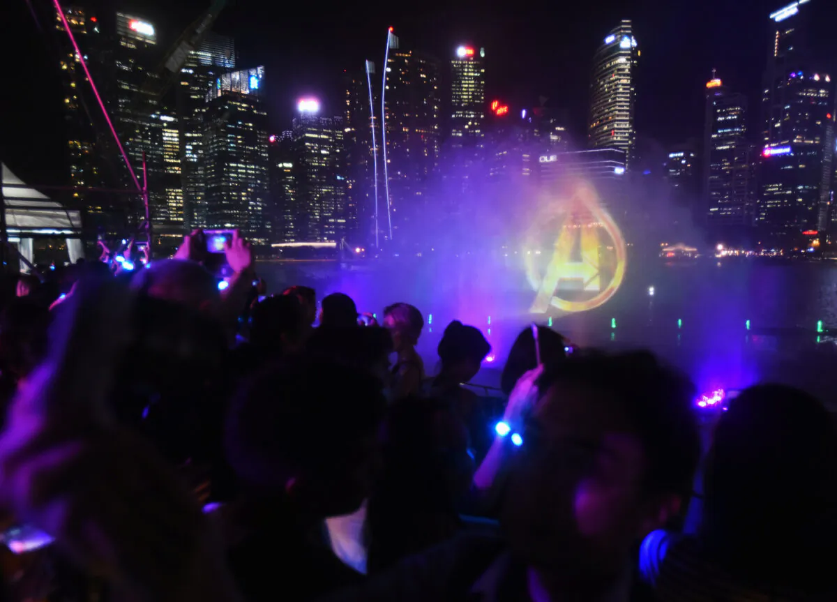 The Avengers logo is projected with the Singapore CBD skyline in the background at a fan event for Marvel Studio's Avengers: Infinity War movie in Singapore on April 16, 2018. (Feline Lim/Reuters)