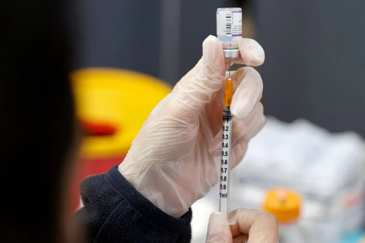 A medic prepares a dose of the Pfizer-BioNTech COVID-19 vaccine in Netanya, Israel, on Jan. 5, 2022. (Jack Guez/AFP via Getty Images)