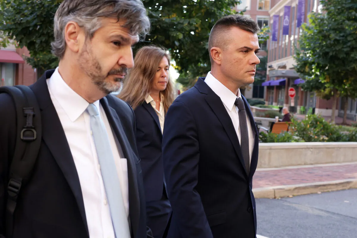 Igor Danchenko, right, walks outside the U.S. courthouse in Alexandria, Va., on Oct. 11, 2022. (Alex Wong/Getty Images)