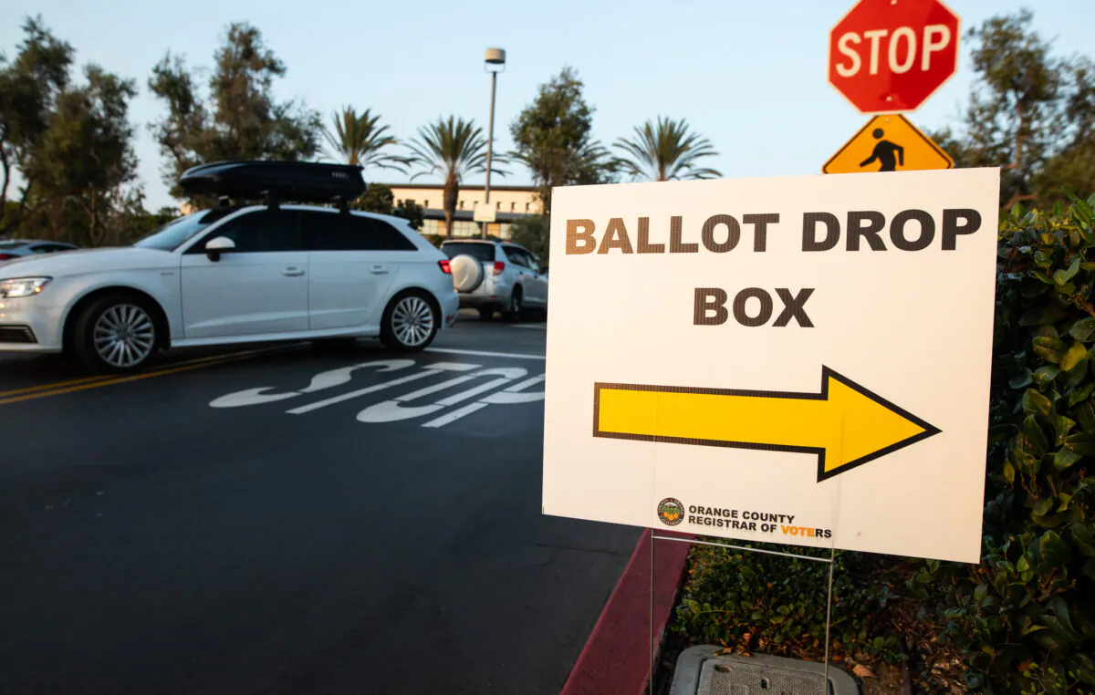 A sign directs to ballot drop boxes in Newport Beach, Calif., on Oct. 12, 2022. (John Fredricks/The Epoch Times)