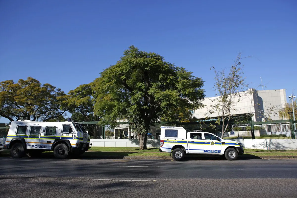 South African Police Service (SAPS) vehicles are seen parked outside the United States (US) Embassy in Pretoria on June 3, 2020. (Photo by Phill Magakoe / AFP) 
