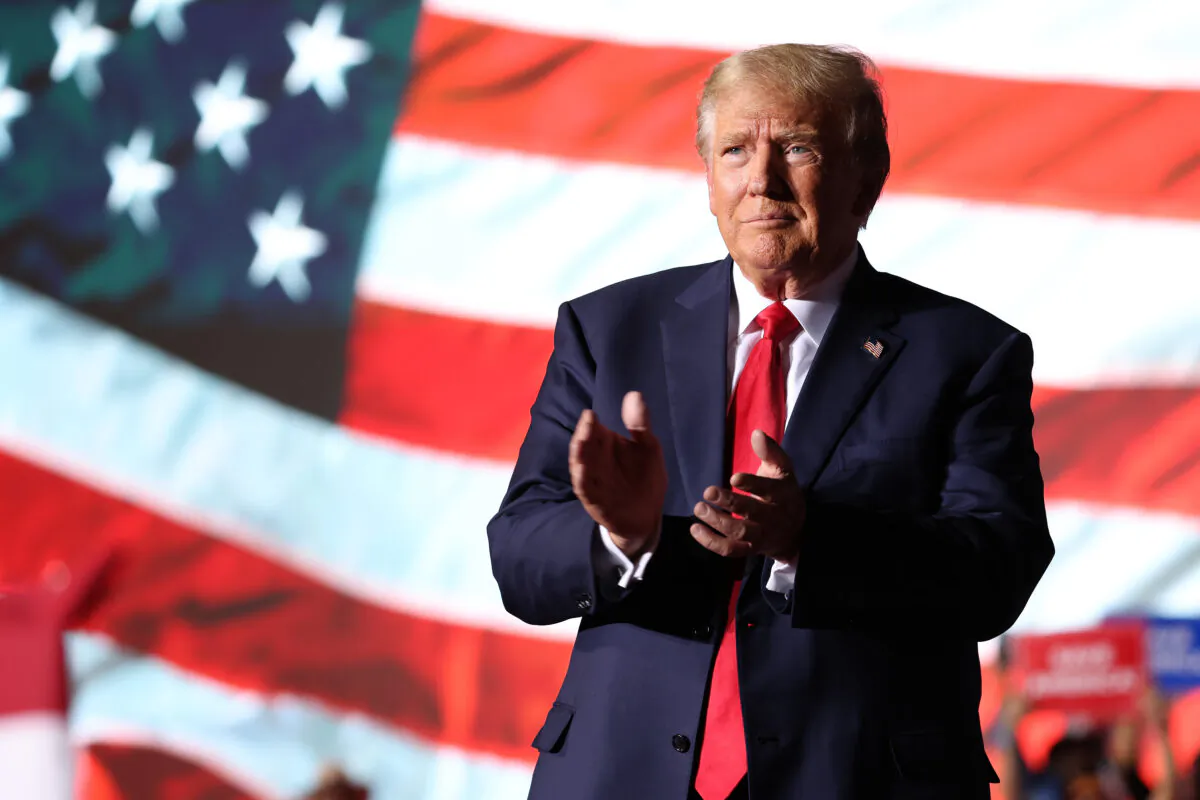 Former U.S. President Donald Trump greets supporters during a campaign rally at Minden-Tahoe Airport in Minden, Nev., on Oct. 8, 2022. (Justin Sullivan/Getty Images)