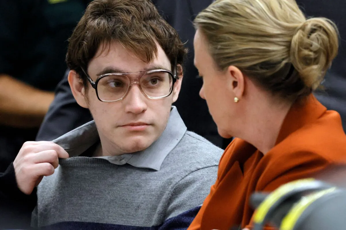 Marjory Stoneman Douglas High School shooter Nikolas Cruz (L) speaks with Assistant Public Defender Melissa McNeill as the verdicts are read in his trial at the Broward County Courthouse in Fort Lauderdale, Fla., on Oct. 13, 2022. (Amy Beth Bennett/Pool/AFP via Getty Images)