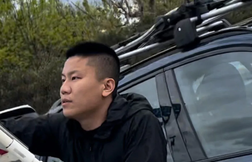 Kang Zhao, 30, was arrested, charged, and sentenced for assaulting a Falun Gong practitioner, Nancy Dong, after he was caught spray-painting a sign belonging to Dong which read: "“CCP ≠ China” and “End the Evil CCP.” (Courtesy of ACT Police)
