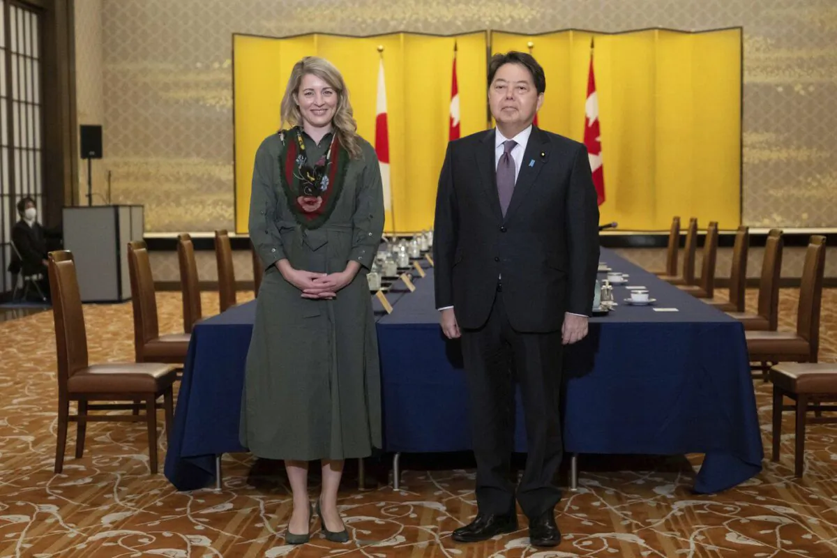 Canadian Foreign Minister Melanie Joly and Japanese Foreign Minister Yoshimasa Hayashi pose for media prior to their meeting at the Iikura Guest House in Tokyo, Oct. 11, 2022. (The Canadian Press/Yuichi Yamazaki)