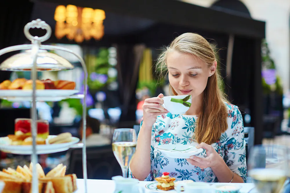 Always hold the tea cup by the handle, not the bowl, and hold the saucer in your off hand if you move away from the table. (Ekaterina Pokrovsky/Shutterstock)