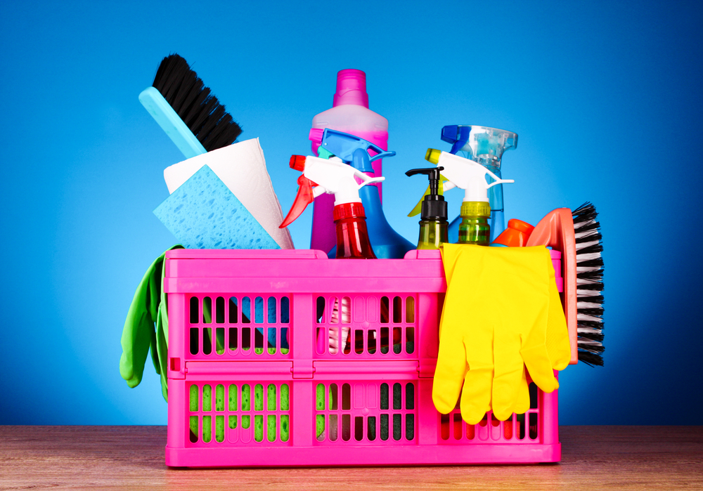Cleaning,Supplies,In,Basket,On,Blue,Background