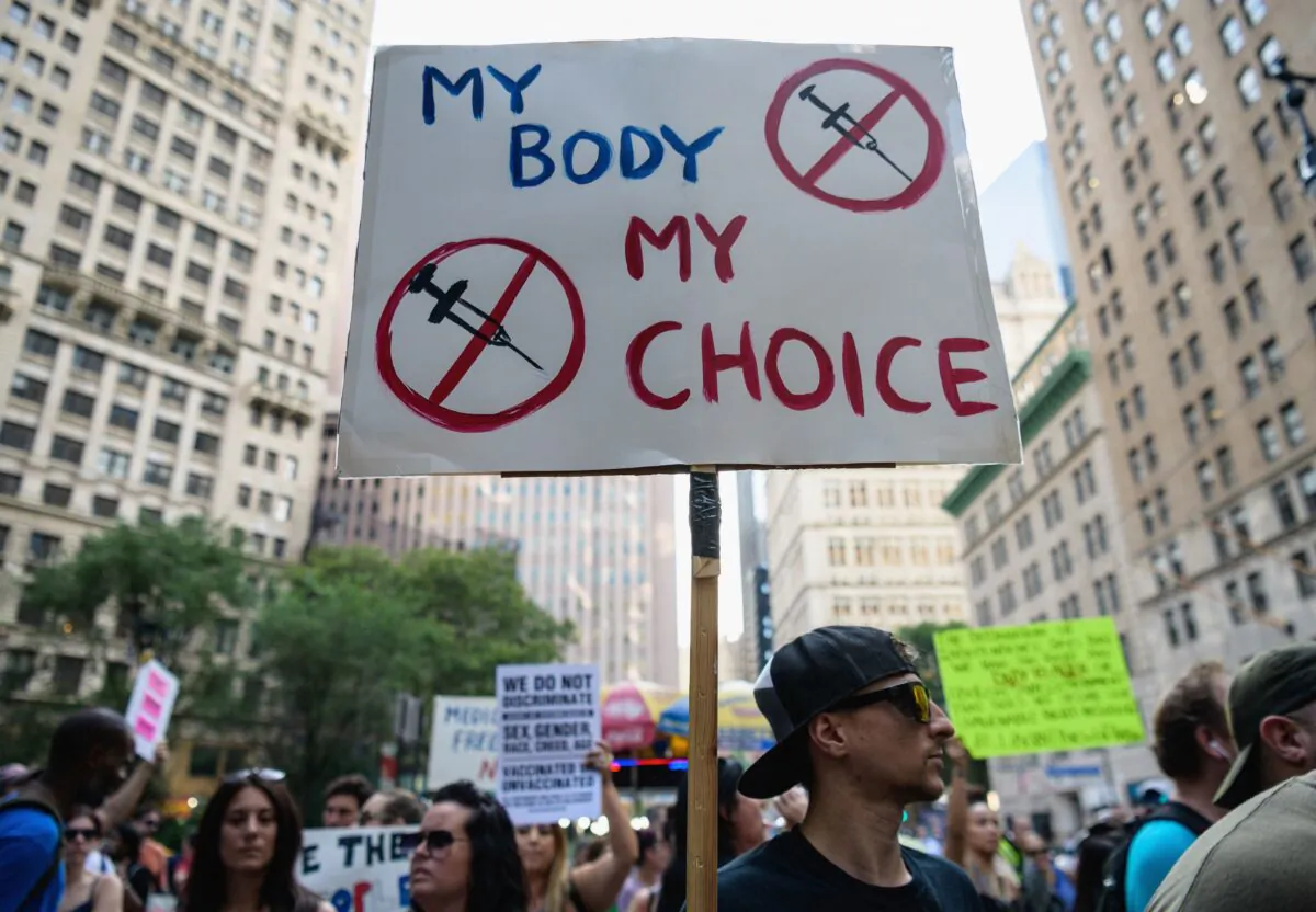 Protesters against COVID-19 vaccine mandates and vaccine passports by the government rally at City Hall in New York City on Aug. 25, 2021. (Angela Weiss/AFP via Getty Images)