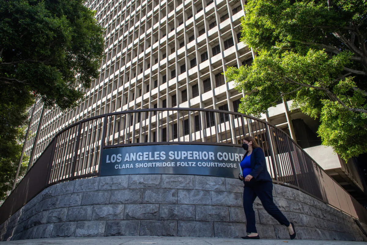 A woman walks by the Clara Shortridge Foltz Criminal Justice Center in Los Angeles on July 21, 2021. (Apu Gomes/Getty Images)