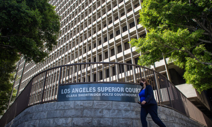 A woman walks by the Clara Shortridge Foltz Criminal Justice Center in Los Angeles on July 21, 2021. (Apu Gomes/Getty Images)
