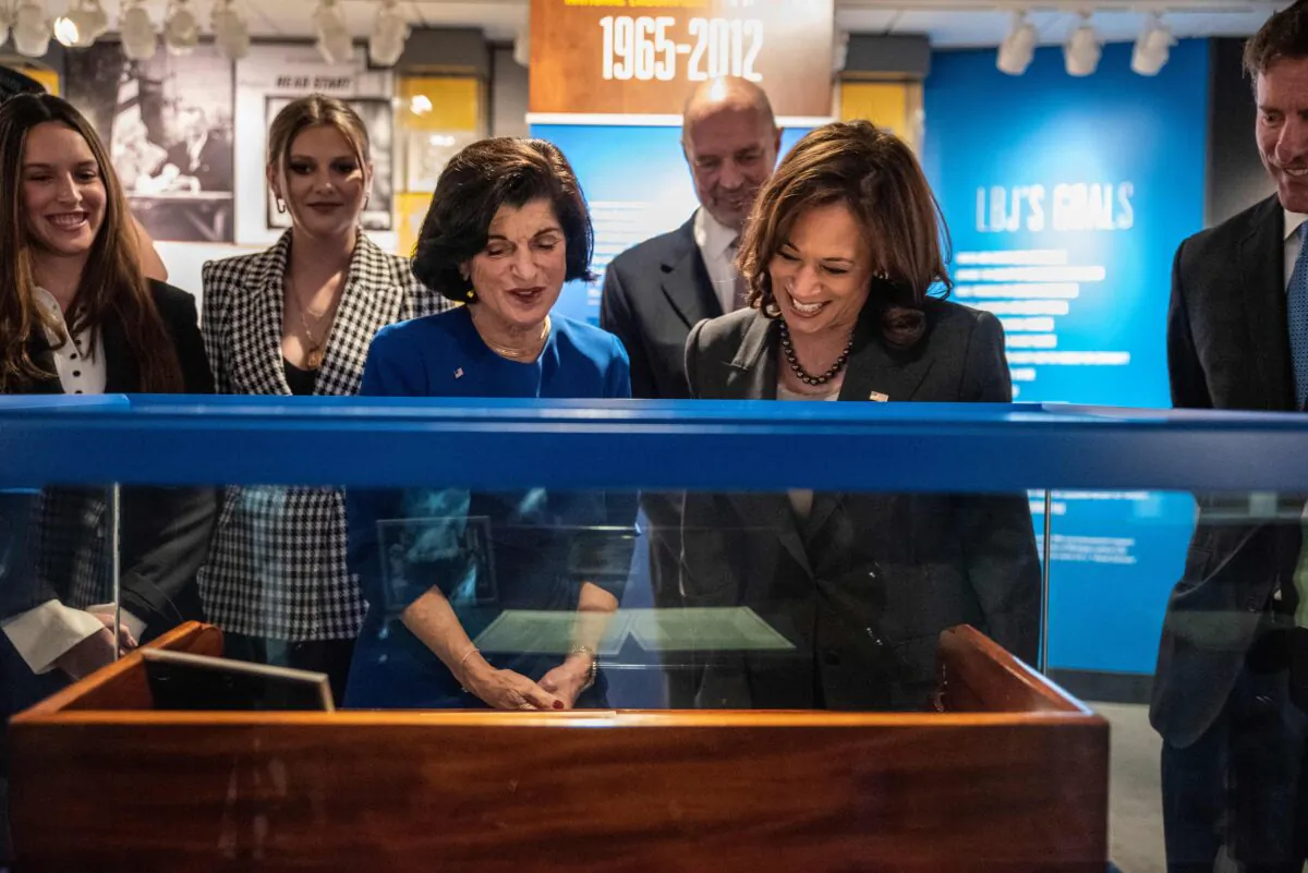 Vice President Kamala Harris and Luci Baines Johnson, daughter of former U.S. President Lyndon B. Johnson, look at a display of the Voting Rights Act at the LBJ Presidential Library in Austin, Texas, on Oct. 8, 2022. (Sergio Flores/AFP via Getty Images)