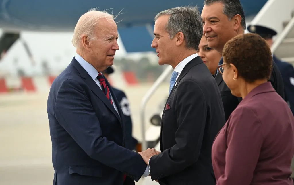 US President Joe Biden is greeted by former LA mayor Eric Garcetti as he arrives at Los Angeles International Airport in California on Oct. 12, 2022. (Saul Loeb/AFP via Getty Images)