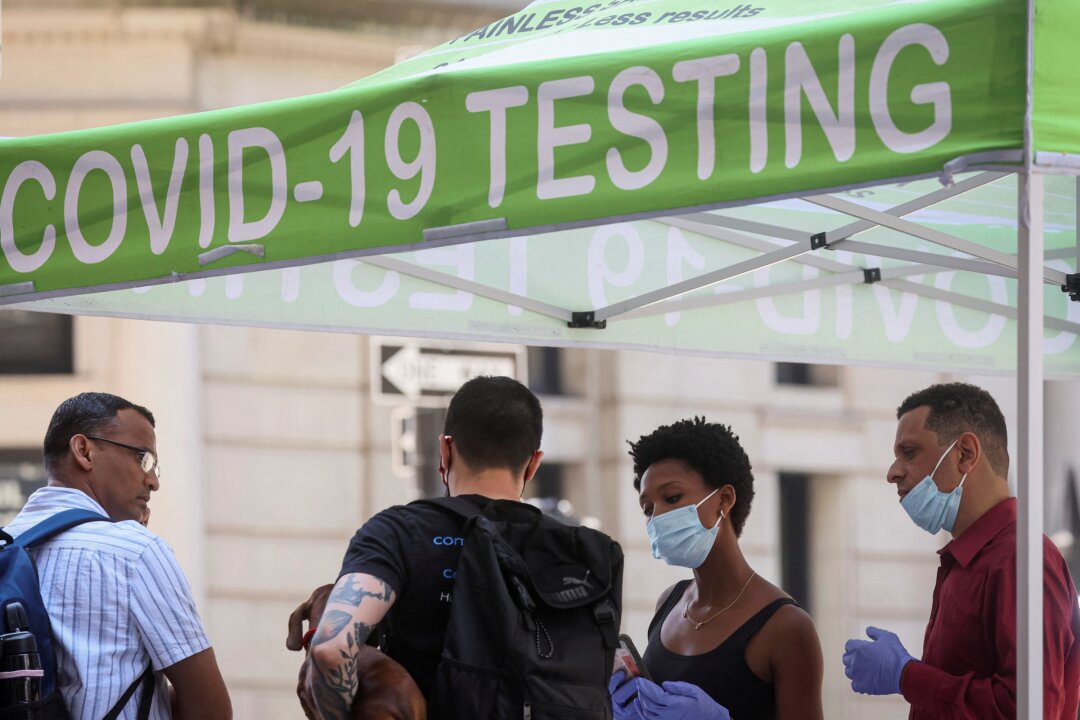 People wait to be tested for the coronavirus at a pop-up site in New York on July 11, 2022. (Brendan McDermid/Reuters)