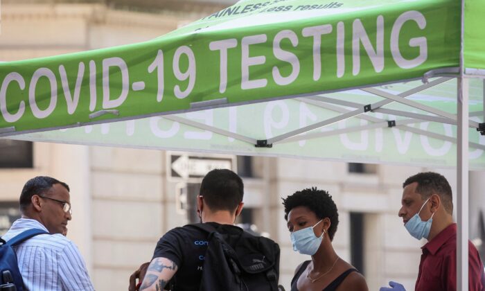 People wait to take coronavirus disease (COVID-19) tests at a pop-up testing site in New York on July 11, 2022. (Brendan McDermid/Reuters)