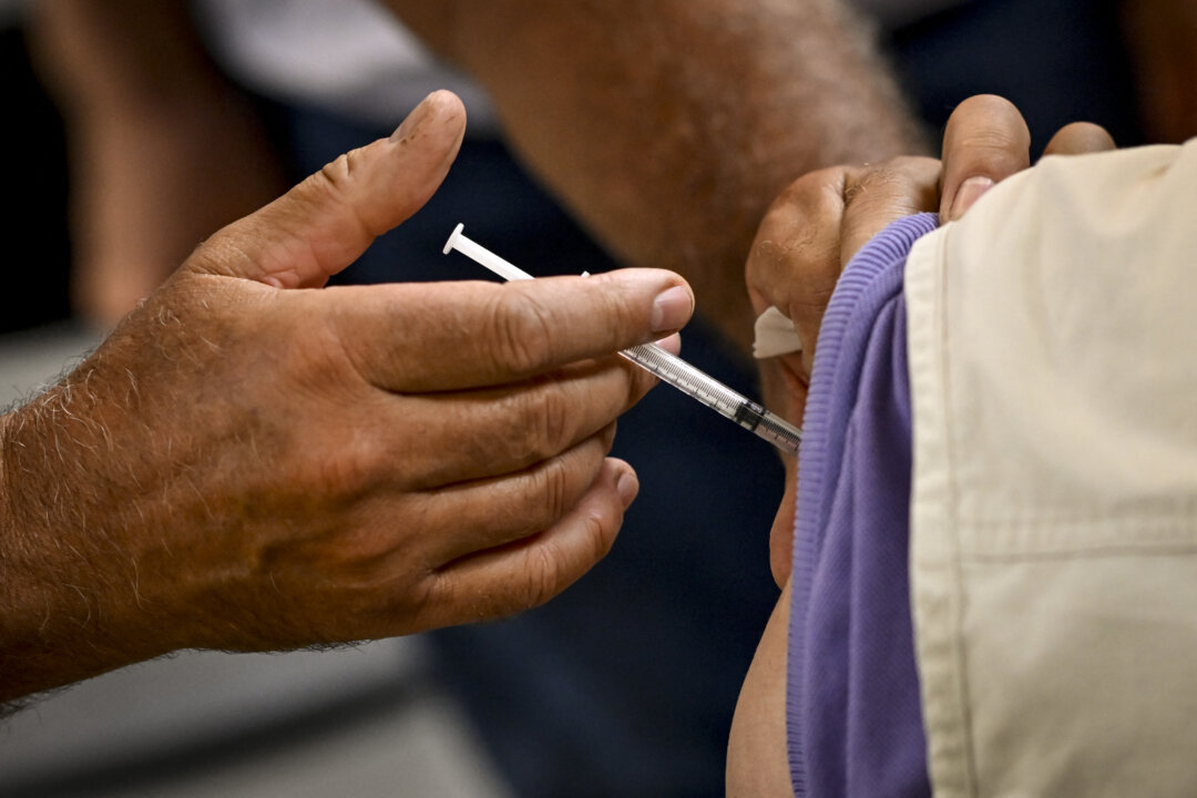 A person receives a COVID-19 vaccine in Antwerp, Belgium on Sept. 12, 2022. (Dirk Waem/Belga Mag/AFP via Getty Images)