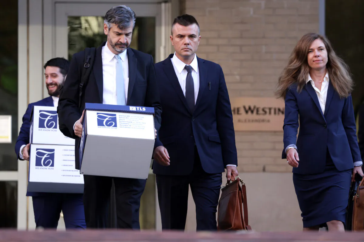 Russian analyst Igor Danchenko (C) arrives at the Albert V. Bryan U.S. Courthouse with his lawyers in Alexandria, Va., on Oct. 11, 2022. (Alex Wong/Getty Images)