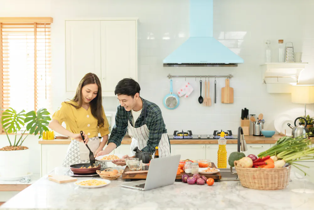 Cooking offers a refuge of certainty, comfort, and connection in an uncertain world. (sirikorn thamniyom/Shutterstock)