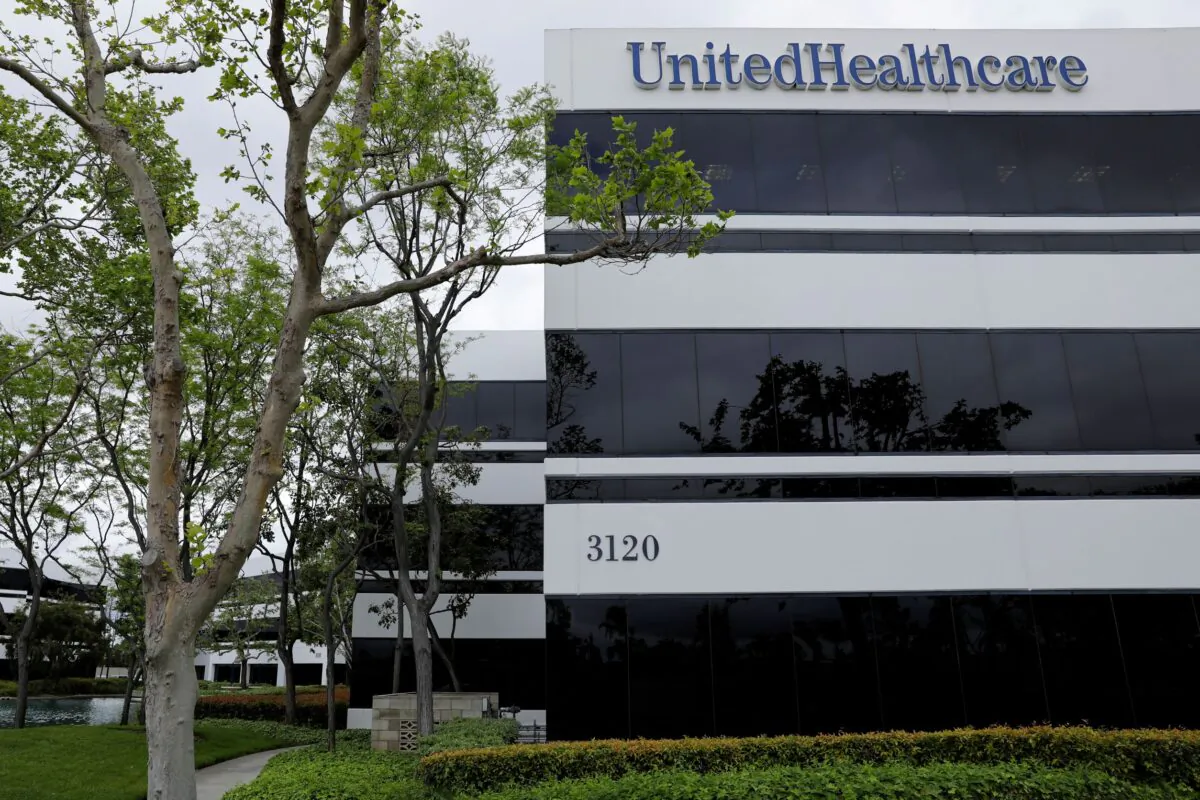 The corporate logo of the UnitedHealth Group appears on the side of one of their office buildings in Santa Ana, Calif., on April 13, 2020. (Mike Blake/Reuters)