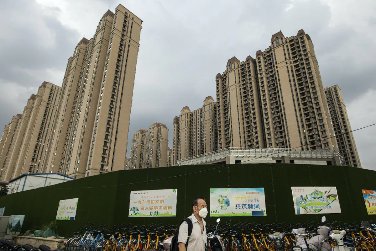 A man walking through a Evergrande built community in Wuhan, Hubei Province, China on Sept. 24, 2021. (Getty Images)