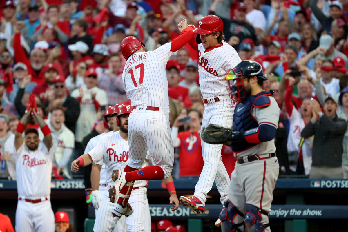Rhys Hoskins (17) of the Philadelphia Phillies celebrates with Bryson Stott #5 after hitting a two run home run against Spencer Strider (65) of the Atlanta Braves during the third inning in game three of the National League Division Series at Citizens Bank Park in Philadelphia, Penn., on Oct. 14, 2022. (Tim Nwachukwu/Getty Images)