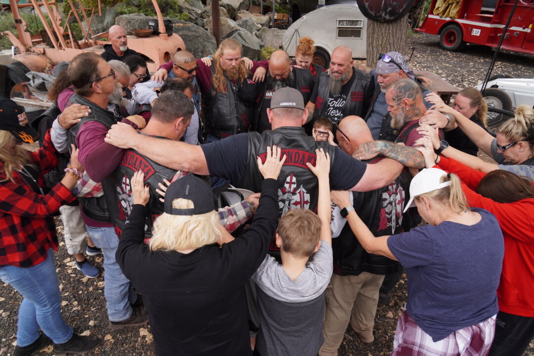 Members of the Ascendants Motorcycle Club hold a prayer celebration in Jerome, Ariz., on Oct. 15, 2022. The Phoenix-based club formed seven years ago to reach out the needy and hopeless. (Allan Stein/The Epoch Times)