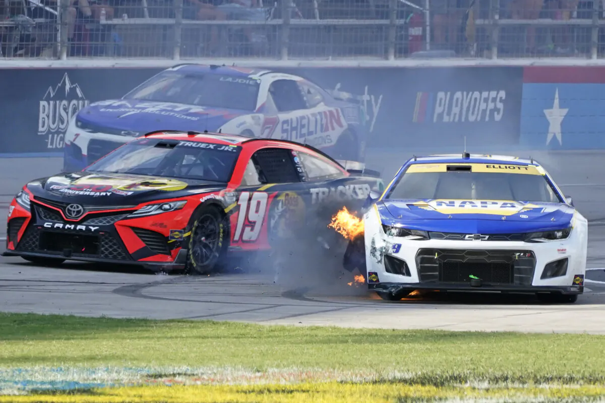 Chase Elliott (9) has his tire catch fire as Martin Truex Jr. (19) and Corey LaJoie (7) drive past during the NASCAR Cup Series auto race at Texas Motor Speedway in Fort Worth, Texas, on Sept. 25, 2022. (Larry Papke/AP Photo)