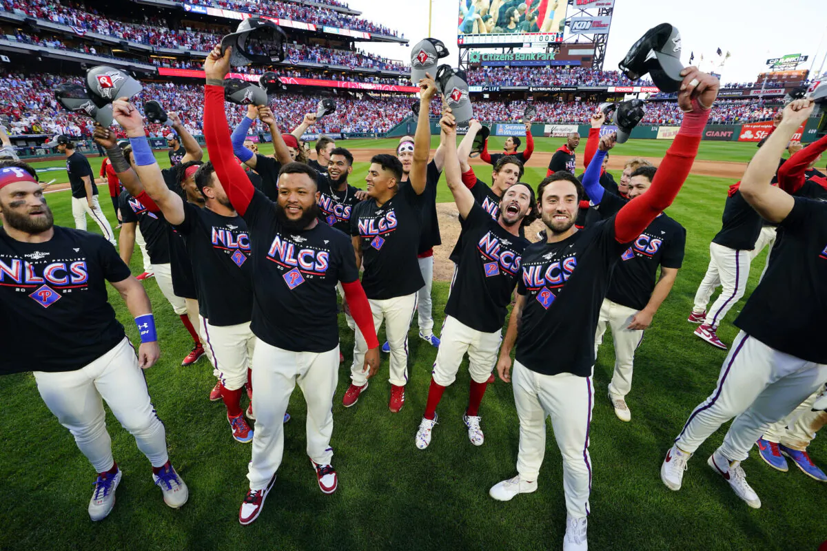 The Philadelphia Phillies pose for a photo after a win over the Atlanta Braves in Game 4 of baseball's National League Division Series, in Philadelphia, Oct. 15, 2022.(Matt Rourke/AP Photo)