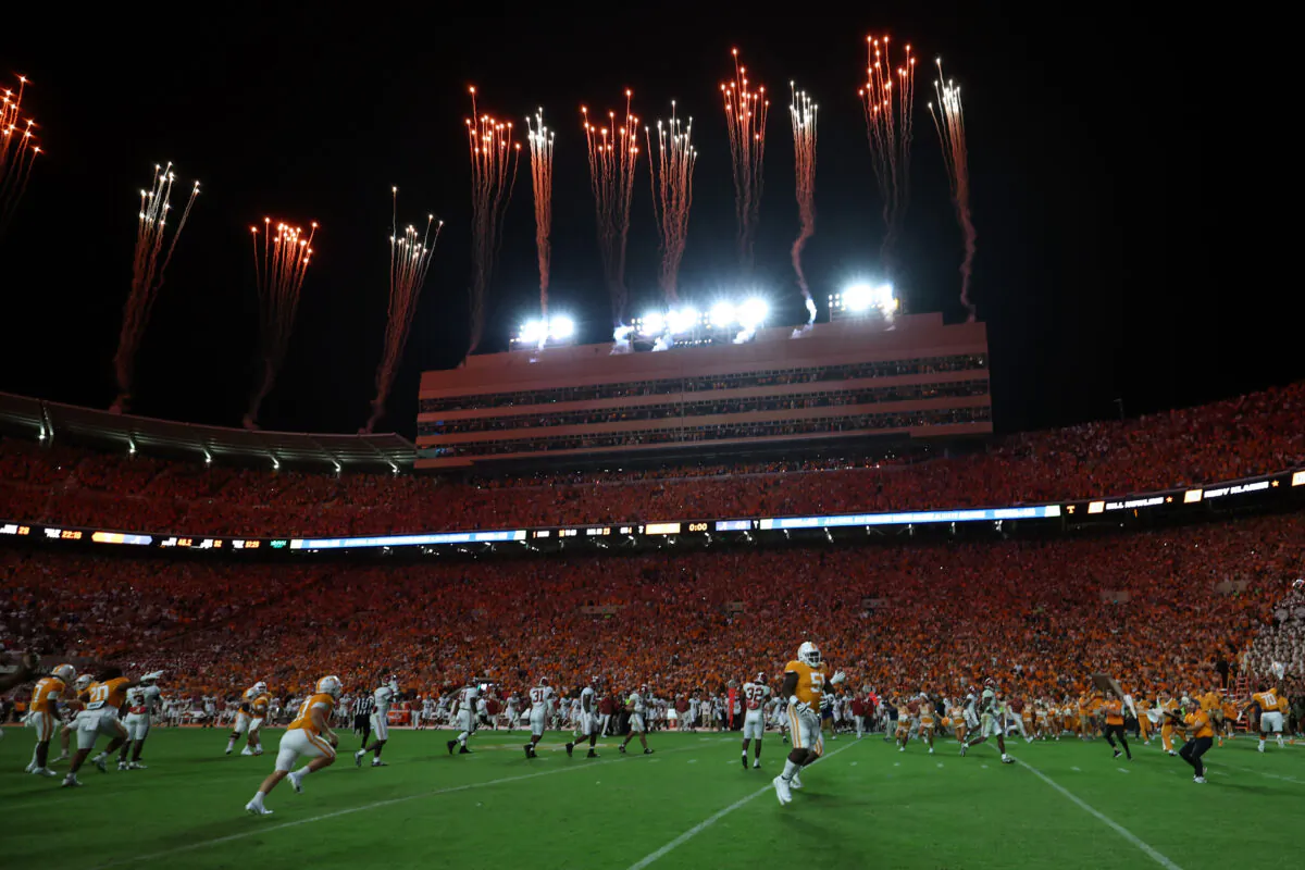 Tennessee Volunteers fans rush the field after the final play as fireworks go off at Neyland Stadium in Knoxville, Tenn., on Oct. 15, 2022. (Donald Page/Getty Images)