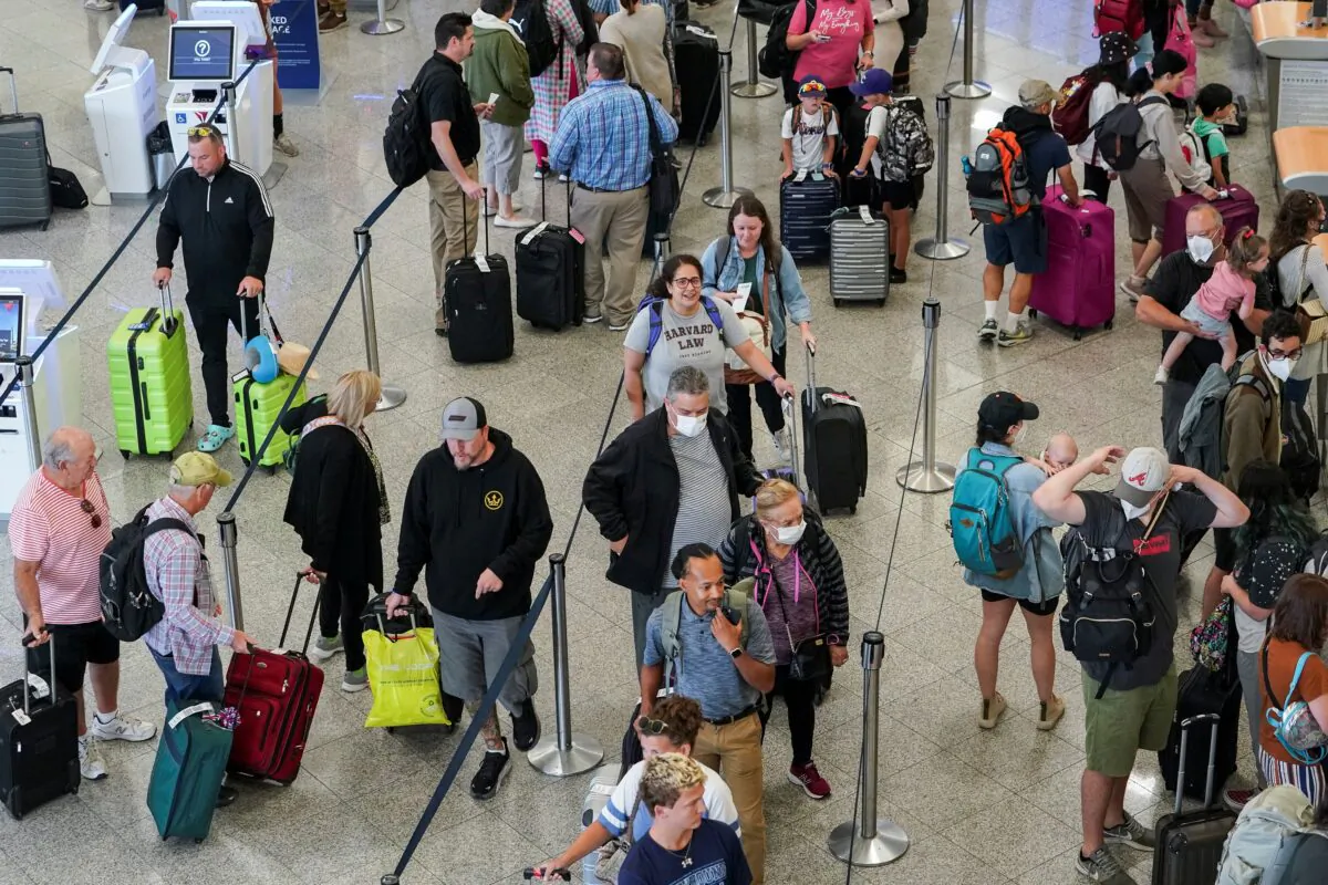Passengers at the Delta Air Lines check in area before their flights at Hartsfield-Jackson Atlanta International Airport in Atlanta on June 28, 2022. (Elijah Nouvelage/Reuters)