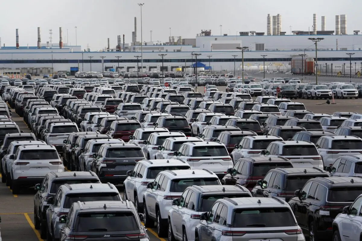 New vehicles are parked in storage lots near the the Stellantis Detroit Assembly Complex in Detroit, Mich., on Oct. 5, 2022. (Paul Sancya/AP Photo)