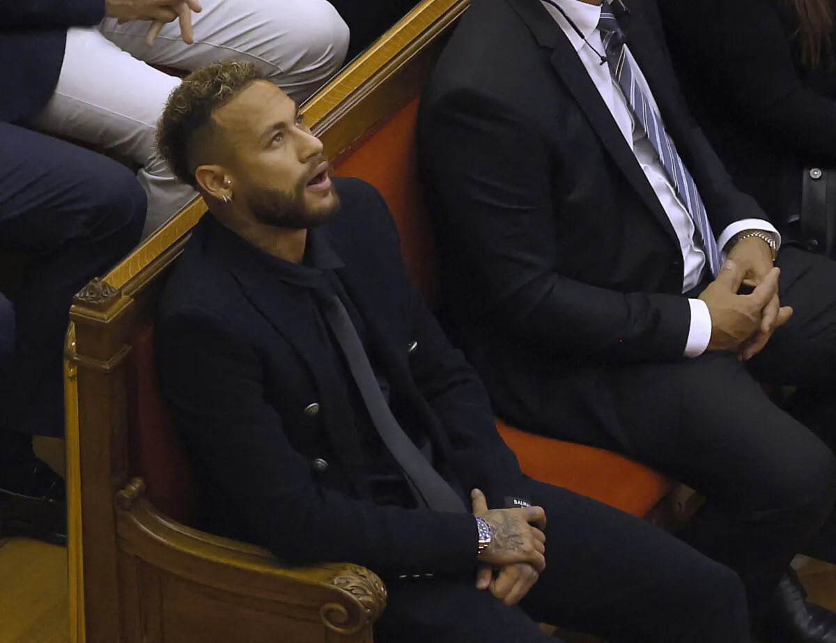 Brazil's Neymar inside the court room as he stands trial on fraud and corruption charges over the transfer to FC Barcelona from Santos in 2013, in Barcelona, Spain, on Oct. 17, 2022. (Albert Gea/Reuters)