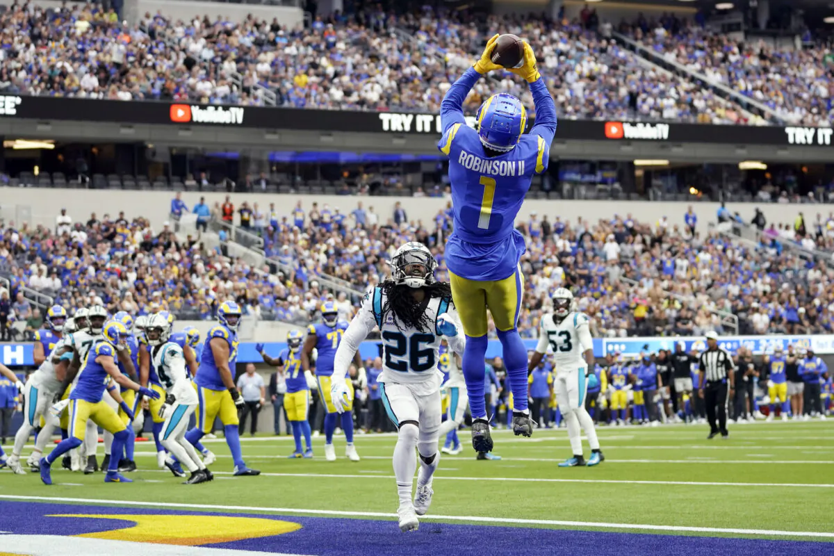 Los Angeles Rams wide receiver Allen Robinson II (1) makes a touchdown catch over Carolina Panthers cornerback Donte Jackson (26) during the first half of an NFL football game in Inglewood, Calif., Oct. 16, 2022. (Ashley Landis/AP Photo)