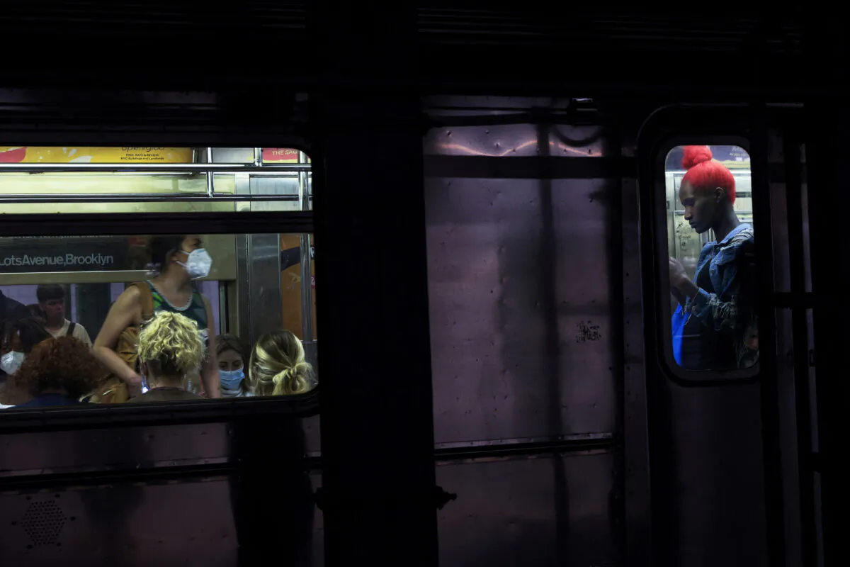People on board a subway at the 42nd street station in New York on June 15, 2022. (Shannon Stapleton/Reuters)