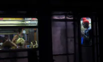 New York City Police Search for Suspect Who Shoved Man Onto Subway Tracks