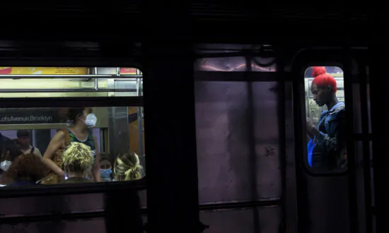 New York City Police Search for Suspect Who Shoved Man Onto Subway Tracks
