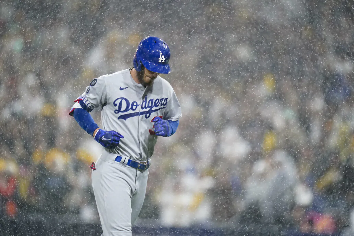 Los Angeles Dodgers' Cody Bellinger jogs back to the dugout after flying out during the eighth inning in Game 4 of a baseball NL Division Series against the San Diego Padres, in San Diego, on Oct. 15, 2022. (Jae C. Hong/AP Photo)