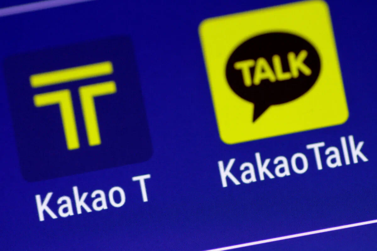 The Kakao messaging app and the Kakao T taxi booking app are seen on a mobile phone in this illustration photo from March 13, 2018. (Thomas White/Reuters)