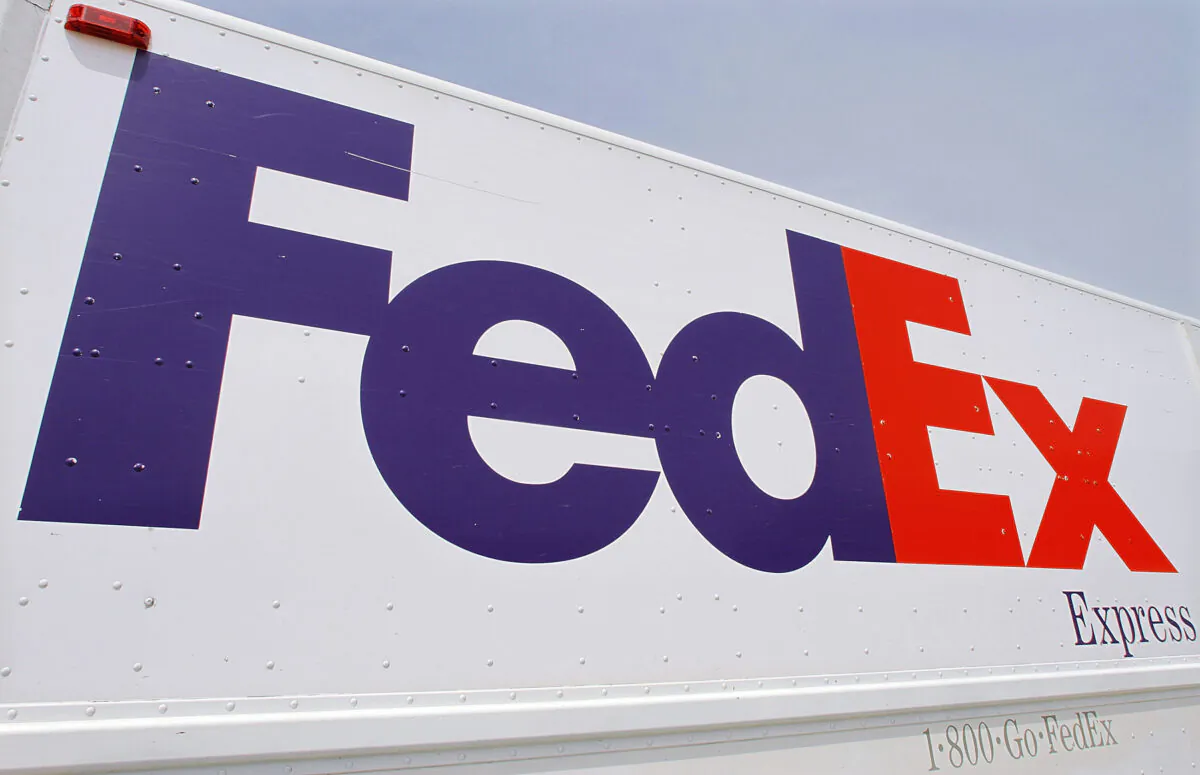 The FedEx logo on a delivery truck in Springfield, Ill., on June 21, 2011. (Seth Perlman/AP Photo)