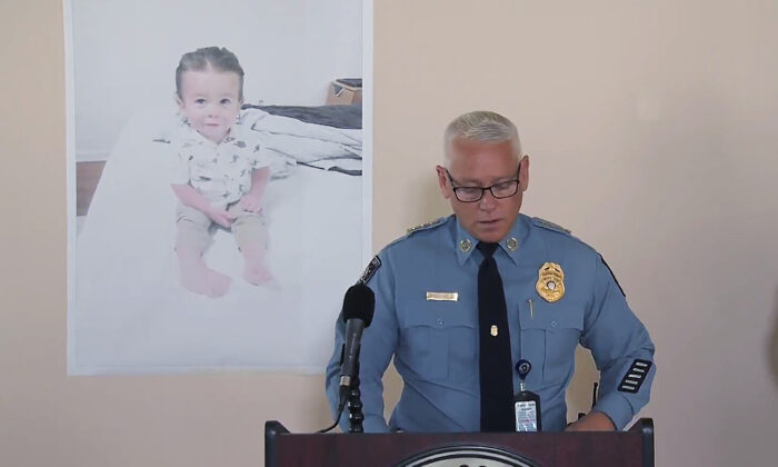 Chatham County Police Chief Jeff Hadley speaks to reporters as he stands in front of a large photo of missing toddler Quinton Simon at a police operations center being used in the search for the boy's remains just outside Savannah, Ga., on Oct. 18, 2022. (WSAV-TV via AP)