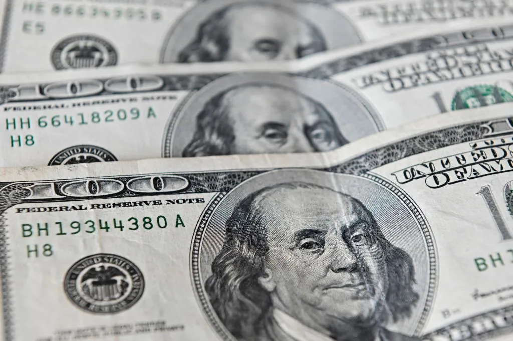 A file photo of U.S. dollars. (Luis Robayo/AFP via Getty Images)