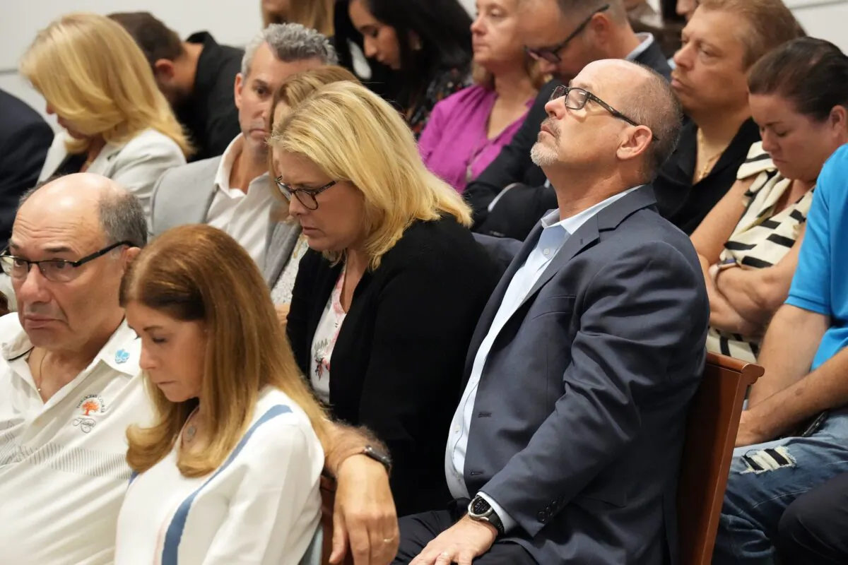Fred Guttenberg, seated with his wife, Jennifer Guttenberg, looks skyward as they hear that their daughter’s murderer will not receive the death penalty as the verdicts are announced in the trial of Marjory Stoneman Douglas High School shooter Nikolas Cruz at the Broward County Courthouse in Fort Lauderdale on Oct. 13, 2022. (Amy Beth Bennett/South Florida Sun Sentinel via TNS)