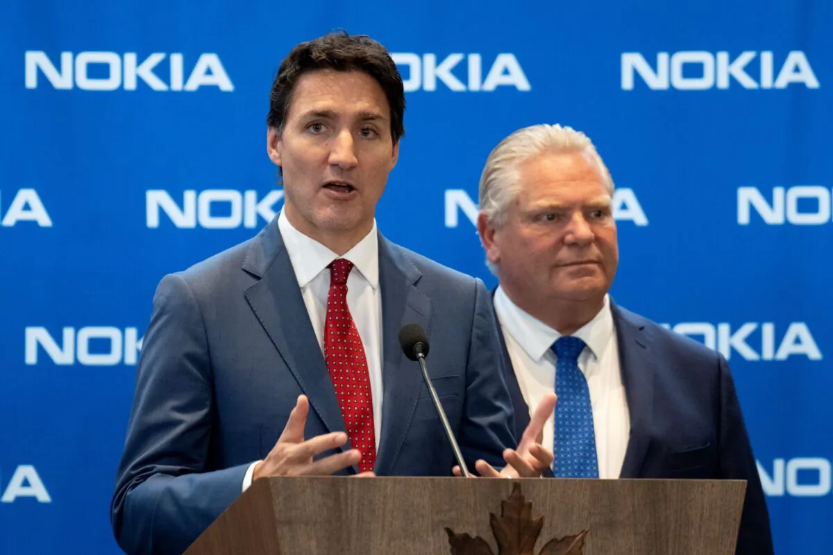 Ontario Premier Doug Ford looks on as Prime Minister Justin Trudeau responds to a question following an announcement at Nokia’s headquarters in Ottawa on Oct. 17, 2022. (The Canadian Press/Adrian Wyld)