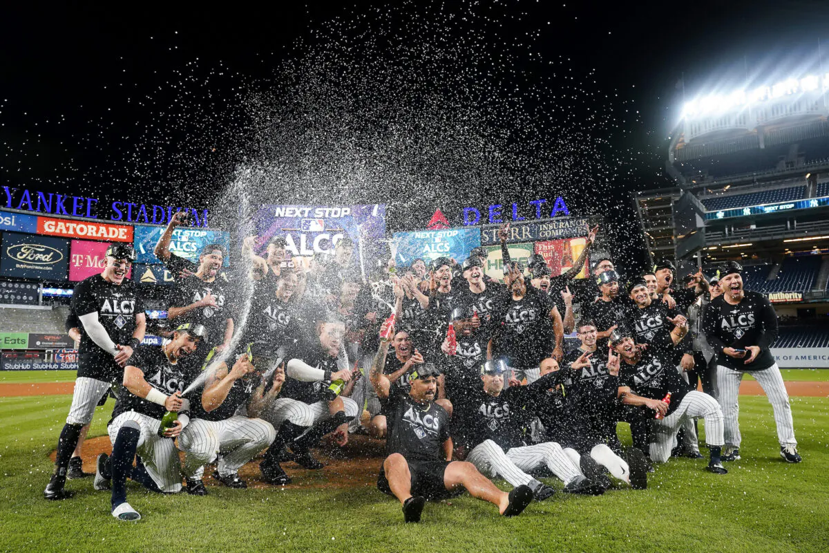 The New York Yankees celebrate on the field after defeating the Cleveland Guardians in Game 5 of an American League Division baseball series, in New York, on Oct. 18, 2022. (Frank Franklin II/AP Photo)
