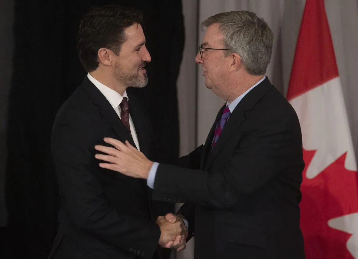 Canadian Prime Minister Justin Trudeau speaks with Ottawa Mayor Jim Watson at the start of a meeting with Mayors of Canada's largest cities in Ottawa on Feb. 6, 2020. (The Canadian Press/Adrian Wyld)